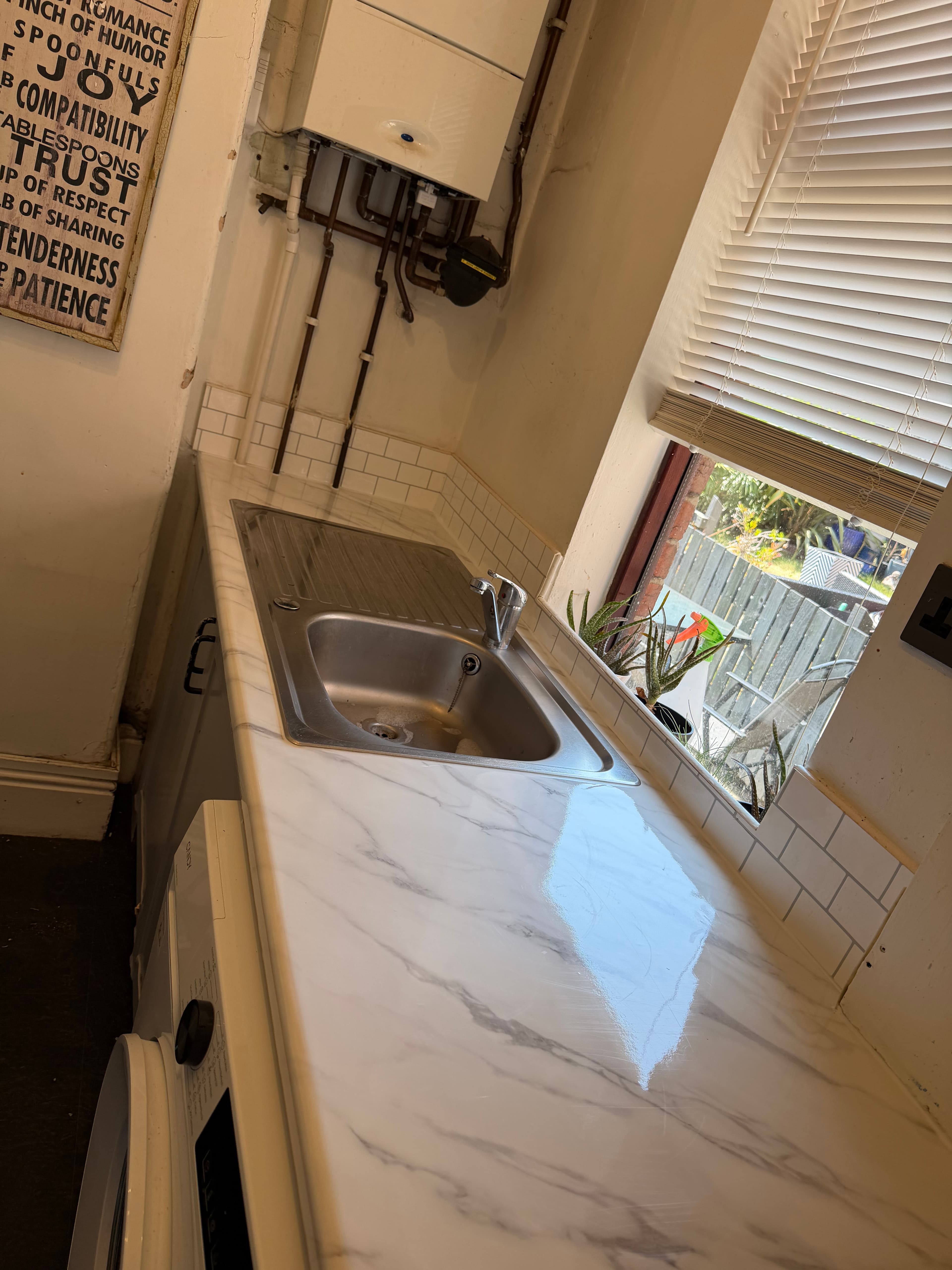 Marble-effect worktop wrap fitted in a Sheffield kitchen