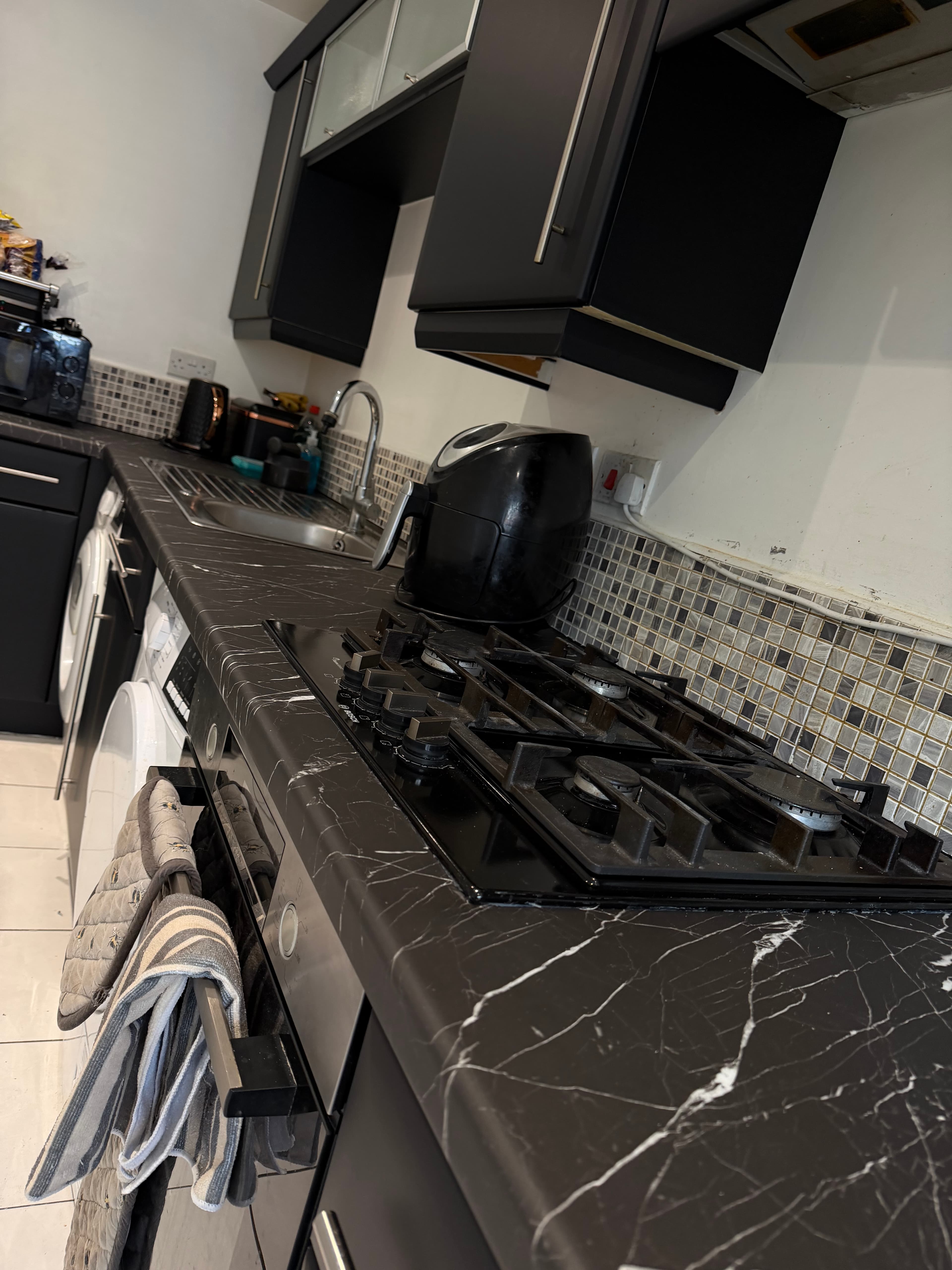 Close-up of black marble worktop wrap after kitchen wrapping in Sheffield